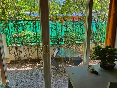 a sliding glass door with a view of a patio at BellaVista Suites By Villas Verdes - Samara Beach in Sámara
