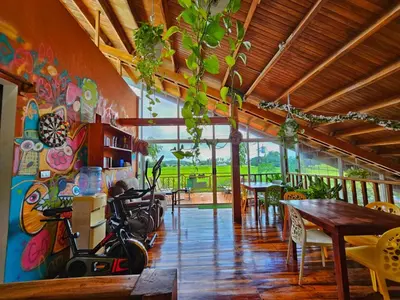 a dining room with a painting on the wall at BellaVista Suites By Villas Verdes - Samara Beach in Sámara