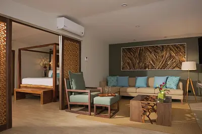 a living room with a couch and a bed at Secrets Papagayo All Inclusive - Adults Only in Papagayo, Guanacaste