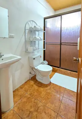 a bathroom with a toilet and a sink at Hostel Cattleya - Monteverde, Costa Rica in Monteverde Costa Rica