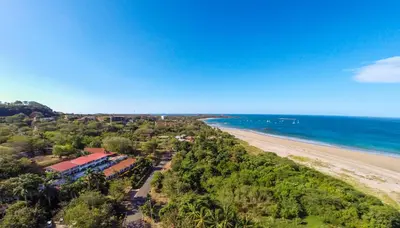 an aerial view of a beach and the ocean at Maravida Boutique Hotel & Resort in Tamarindo