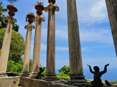 a group of columns in a park at Hotel Villa Caletas in Jacó