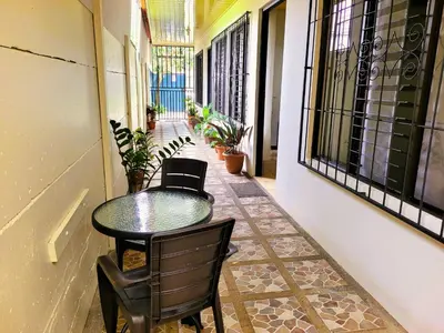 a small table and chairs on a balcony at Butterfly Apartments in Fortuna