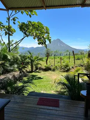 a view of a mountain from the porch of a house at Casa Torre Eco- Lodge in Fortuna