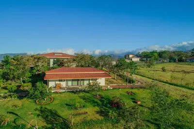 an aerial view of a house in a field at Vida Mountain Resort & Spa Adults Only in San Ramón