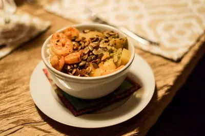 a bowl of shrimp on a plate on a table at Vida Mountain Resort & Spa Adults Only in San Ramón
