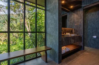 a bathroom with a sink and a large window at Rancho Pacifico - Boutique Hotel for Adults in Uvita