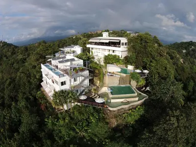 an aerial view of a large house on a mountain at Gaia Hotel & Reserve- Adults Only in Manuel Antonio