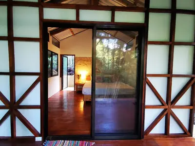 a room with a door leading to a bedroom at Cascada Elysiana in Platanillo