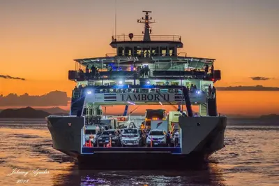 a ferry with cars on it in the water at Ruiselares in Puntarenas