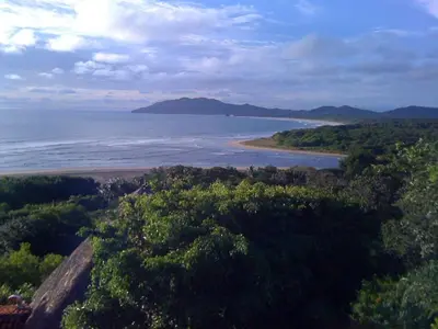 a view of a beach with trees and the ocean at Villa Ethir in Tamarindo