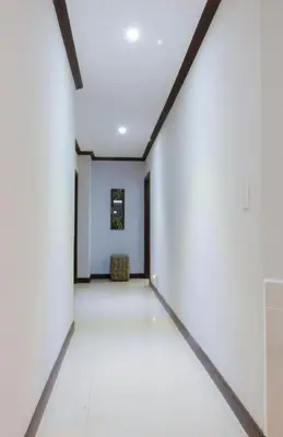 an empty room with white walls and white tile floors at Diamante del Sol Ocean front condos, Micasas in Jacó