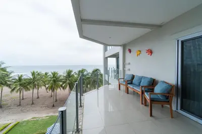 a balcony with chairs and a view of the beach at Diamante del Sol Ocean front condos, Micasas in Jacó