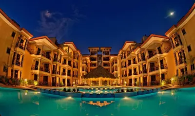 a building with a pool of water in front of it at Bahia Encantada beach front proyect, Micasas in Jacó