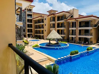 an apartment complex with a swimming pool and a resort at Bahia Encantada beach front proyect, Micasas in Jacó