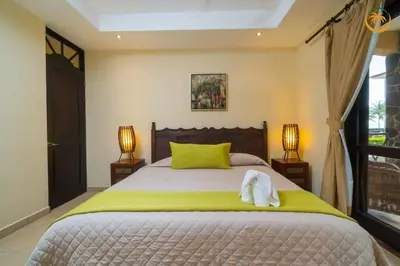 a bedroom with a bed with a towel on it at Bahia Encantada beach front proyect, Micasas in Jacó