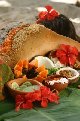 a close up of a turkey on a plate with other foods at Hotel Tropico Latino in Santa Teresa Beach