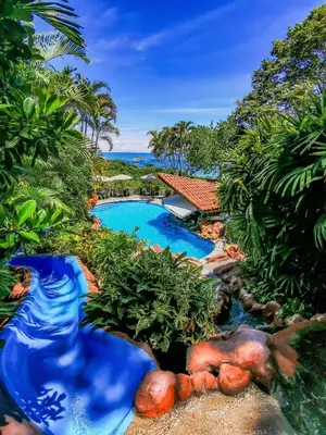 an aerial view of a swimming pool in a resort at Si Como No Resort & Wildlife Refuge in Manuel Antonio