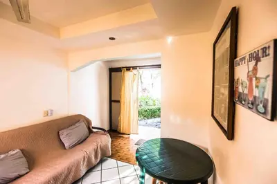 a living room with a couch and a table at La Dolce Vita in Esterillos