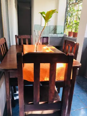 a wooden table with a plant sitting on top of it at Duerme tranquilo in Alajuela City