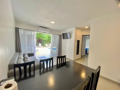a living room with a table and a couch at Uvita Paradise in Uvita