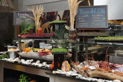 a buffet with seafood and other food items on display at InterContinental Costa Rica at Multiplaza Mall by IHG in San José