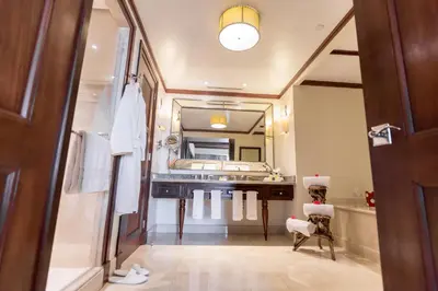 a bathroom with a sink and a large mirror at InterContinental Costa Rica at Multiplaza Mall by IHG in San José