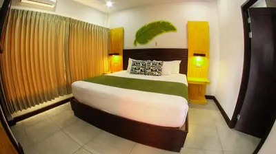 a bedroom with a large bed in a room at Apartamentos Equipados RyA del Volcán in Fortuna