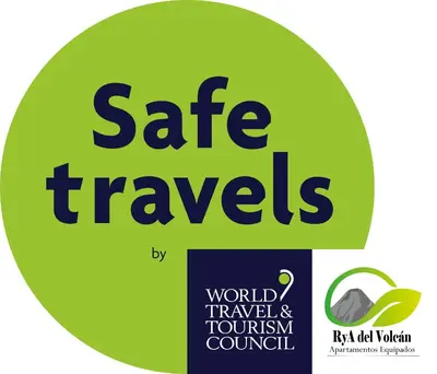 a green circle with the words safe travels and world tourism council at Apartamentos Equipados RyA del Volcán in Fortuna