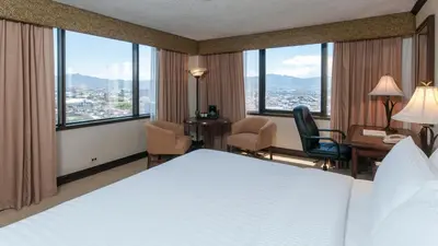 a hotel room with a bed and a desk at Delta Hotels by Marriott San Jose Aurola in San José