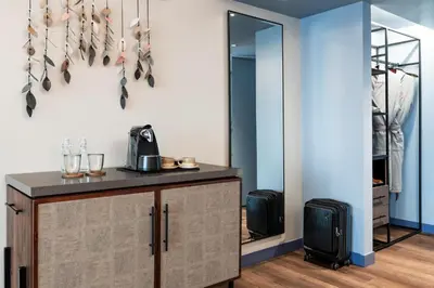 a dressing room with a cabinet and a mirror at Hyatt Centric San José Escazú in San José