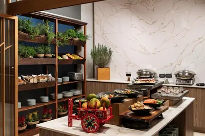a buffet in a restaurant with food on display at Hyatt Centric San José Escazú in San José