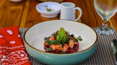 a bowl of food sitting on a table at Pacuare Lodge by Böëna in Bajo Tigre
