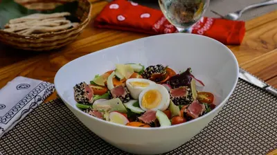 a bowl of salad with eggs on a table at Pacuare Lodge by Böëna in Bajo Tigre