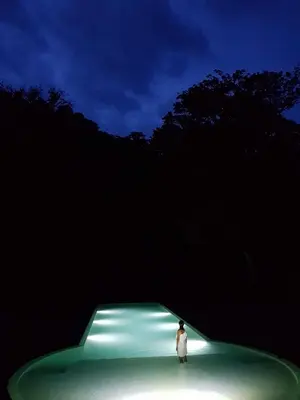 a person standing in front of a green tunnel at Pacuare Lodge by Böëna in Bajo Tigre