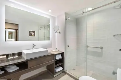 a bathroom with a sink and a shower at Crowne Plaza San Jose La Sabana by IHG in San José