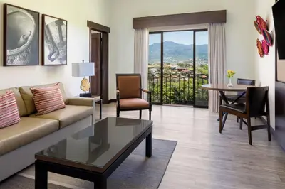 a living room with a couch and a table at Costa Rica Marriott Hotel Hacienda Belen in San José