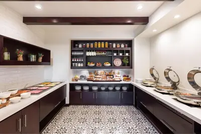 a kitchen with a buffet of food on display at Costa Rica Marriott Hotel Hacienda Belen in San José