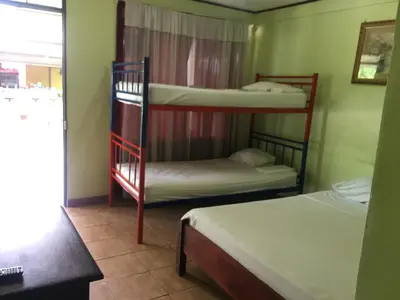 a room with two bunk beds and a window at Cabinas Brisas del Golfo in Colorado