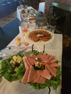 a table with a plate of food on it at Hotel Villa Tournon in San José