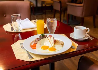 a plate of eggs and toast on a table at Studio Hotel Boutique in San José