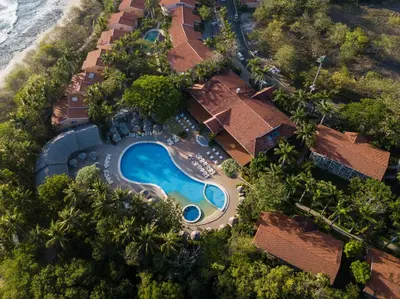 an aerial view of a resort with a swimming pool at Occidental Tamarindo - All Inclusive in Tamarindo