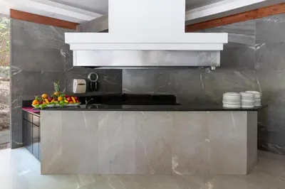 a kitchen with a sink and a counter top at Occidental Tamarindo - All Inclusive in Tamarindo