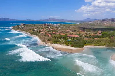 an aerial view of a resort on a beach at Occidental Tamarindo - All Inclusive in Tamarindo