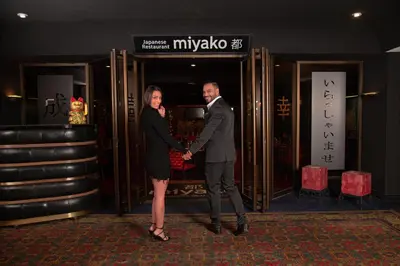 a man and a woman standing in front of a door at Barceló San José in San José