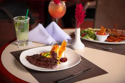 a table with two plates of food and drinks at Barceló San José in San José