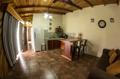 a kitchen with a refrigerator and a counter top at Villas Fernanda in Fortuna