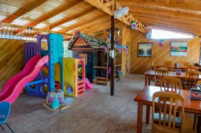 a play room with a slide and a playground at Villas Fernanda in Fortuna