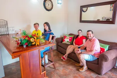 a group of people sitting in a living room at Villas Fernanda in Fortuna