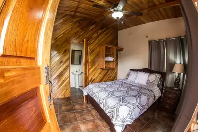 a bedroom with a bed and a wooden ceiling at Villas Fernanda #2 in Fortuna
